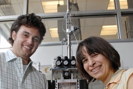 Mechanical Engineering Professor Anette Hosoi and graduate student Amos Winter developed a robo-clam,that could lead to "smart" anchoring technologies. Outside the testing device they hold clamshells of some of the clams they tested.