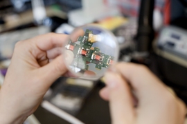 To attach to each other, to communicate and to share power, the cubes use 'electropermanent magnets,' materials whose magnetism can be switched on and off with jolts of electricity. Each cube has magnets — recognizable by the reddish wires wrapped around them — on four of its six faces.