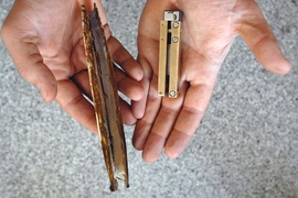 A razor clam (left) and the RoboClam 