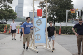 Phi Delta Theta created a dousing contraption that filled a bucket via tubes. Lou Gehrig was a member of this fraternity when he was a student at Columbia University.