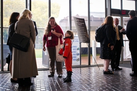 An aspiring astronaut waits for the next presentation to begin.