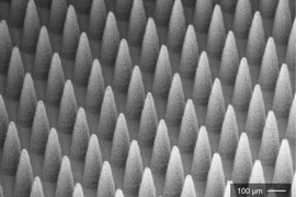 A dense array of electrospray emitters (1900 emitters in 1 centimeter square).