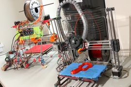 Two RepRap 3-D printers built by Spielberg.