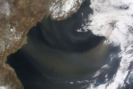 A 2012 satellite image shows a dust storm blowing over the Sea of Japan out to the North Pacific.
