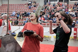 “The really cool thing about this class is, they’re all starting from raw materials, from scratch,” instructor Sangbae Kim says. “And they always come up with something we never expected.” Pictured, participants rejoice as their robot accomplishes a task.