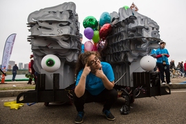 Rosa Lafer-Sousa, an MIT researcher, poses in front of a giant mock up of her brain.