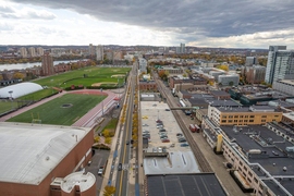 View of Vassar Street in Cambridge, facing west. The West Garage parking facility is on the right side of the street.