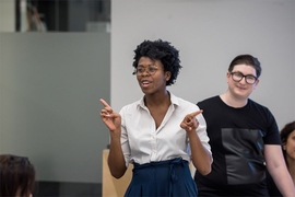 At the MIT Day of Action, Jessica Myers, a graduate student in the Department of Urban Studies and Planning, speaks in a session on the disproportionate effects of gentrification. 