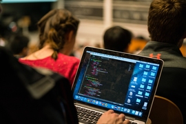 During a typical class, Jaakkola covers multiple chalkboards with equations.
