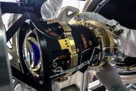 Engineers test one of the TESS cameras at the Kavli Institute lab.