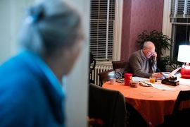 As his wife Rebecca looks on in their home, Rainer Weiss answers early morning questions from journalists assembled at the Nobel Foundation's press conference in Stockholm, Sweden, shortly after learning that he had won the Nobel Prize in physics.