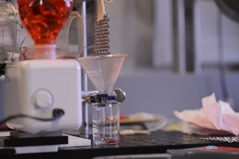 The team’s lab setup was used to test the powerplant condenser system. The mesh is placed above the funnel at right to collect the water that condenses on the mesh.