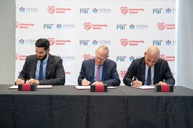 This morning’s ceremonial signing at the J-Clinic launch event. From left to right: Hassan Jameel, president of Community Jameel Saudi Arabia; L. Rafael Reif, president of MIT; Fady Jameel, president of Community Jameel International.