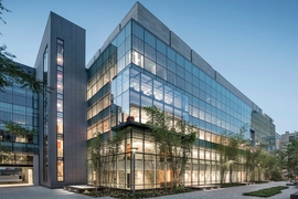 The MIT.nano building, at the center of campus adjacent to the Great Dome, has expansive glass facades that allow natural light into the labs while giving visitors a clear view of the research in action.