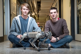 Lead developer Benjamin Katz, left, and co-author Jared Di Carlo, were inspired by a class they took last year, taught by EECS Professor Russ Tedrake, and set about programming the mini cheetah to perform a backflip.