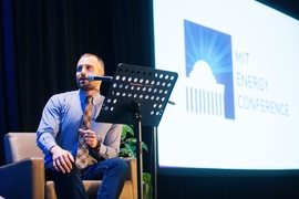 Steven Lacey, host of The Energy Gang, leads a live taping of the show during the MIT Energy Conference.