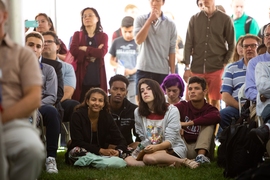 Members of the incoming class of 2023 and their families listen to remarks by President Reif and three professors who are also MIT alums.