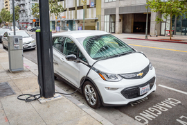 Electric car at charging station.